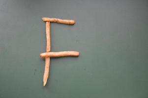 Letters of the english alphabet laid out from french fries photo