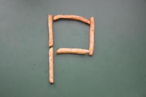 Letters of the english alphabet laid out from french fries photo