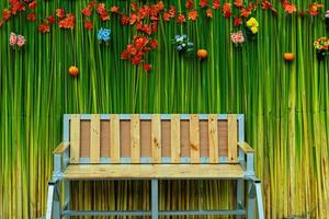 Wooden chair on green background photo