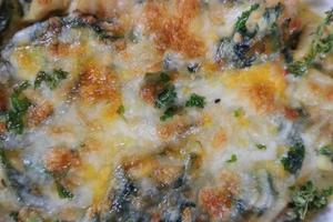 Baked Spinach with Cheese is delicious and healthy dish as it provides healthy dose of vitality and host of anti oxidants. thus helping to slow down aging and degeneration of cells in the body photo