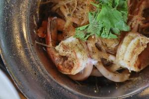 Baked river prawns with vermicelli in a pot is a very popular dish in Thailand because it is easy to make and delicious. River prawns and vermicelli in the casserole are seasoned with a special sauce.