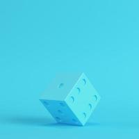 Dice on bright blue background in pastel colors. Minimalism concept photo