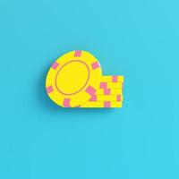 Yellow casino chips on bright blue background in pastel colors photo