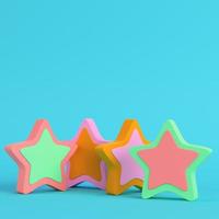 Colorful abstarct stars on bright blue background in pastel colors. Minimalism concept photo