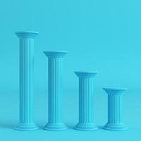 Four ancient pillars on bright blue background in pastel colors photo