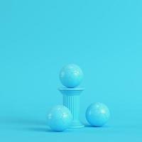 Column with soccer ball on bright blue background in pastel colors photo