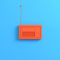 Orange radio on bright blue background photo