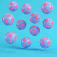 Pink flying soccer balls on bright blue background in pastel colors photo
