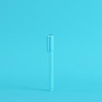 Marker pen on bright blue background in pastel colors. Minimalism concept photo