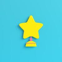 Yellow star with stand on bright blue background in pastel colors. Minimalism concept photo