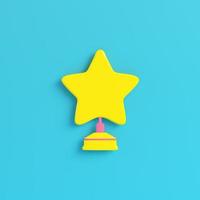 Yellow star with stand on bright blue background in pastel colors. Minimalism concept photo