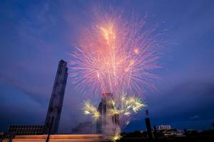 fireworks on the river in the blue sky background photo