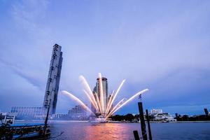 fireworks on the river in the blue sky background photo