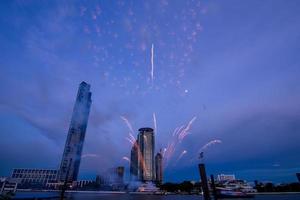 fireworks on the river in the blue sky background photo