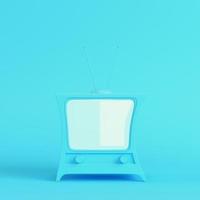Cartoon styled tv on bright blue background in pastel colors photo