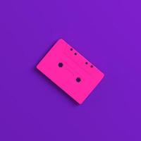 Audio cassette tape cup on purple background. Minimalism concept photo