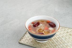 Peach Gum, Chinese traditional drink that contains peach gum, bird nest, red dates, snow fungus, goji berry, and rock sugar. photo