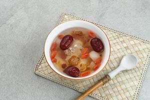 Peach Gum, Chinese traditional drink that contains peach gum, bird nest, red dates, snow fungus, goji berry, and rock sugar. photo