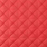 Stitched upholstery leather bright red background with buttons photo