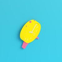 Yellow retro alarm clock on bright blue background in pastel colors. Minimalism concept photo