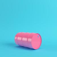 Pink oil barrel on bright blue background in pastel colors photo