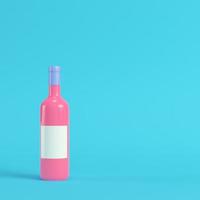 Wine bottle with blank lable on bright blue background in pastel colors. Minimalism concept photo