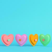 Colorful abstract heart shape on bright blue background in pastel colors