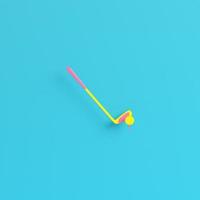 Yellow golf club with golf ball  on bright blue background in pastel colors. Minimalism concept photo