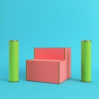 Red display stand with two cylinders on bright blue background in pastel colors photo