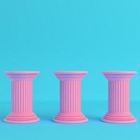 Three ancient pillars on bright blue background in pastel colors photo