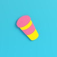 Yellow coffee cup on bright blue background in pastel colors. Minimalism concept photo