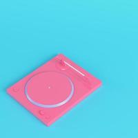 Pink turntable on bright blue background in pastel colors photo