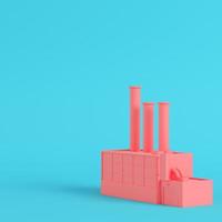 Pink factory on bright blue background in pastel colors photo
