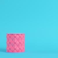 Pink stitched pedestal on bright blue background in pastel colors photo