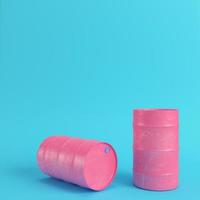 Pink oil barrel on bright blue background in pastel colors photo