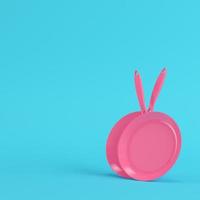 Pink frying pans on bright blue background in pastel colors photo