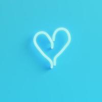 Heart shape neon light on bright blue background in pastel colors photo