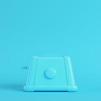 Toaster on bright blue background in pastel colors. Minimalism concept photo