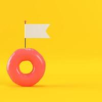 Donut with blank flag on yellow background photo