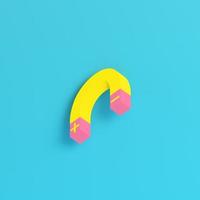 Yellow magnet on bright blue background in pastel colors photo