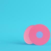 Vinyl records on bright blue background in pastel colors. Minimalism concept photo