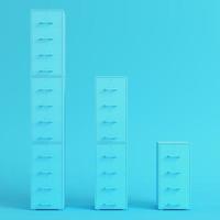 Blue filing cabinets on bright blue background in pastel colors photo