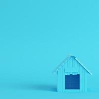 Doghouse on bright blue background in pastel colors photo