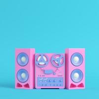 Reel to reel type recorder on bright blue background in pastel colors. Minimalism concept photo