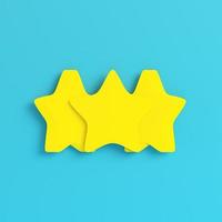 Yellow three abstract stars on bright blue background in pastel colors photo