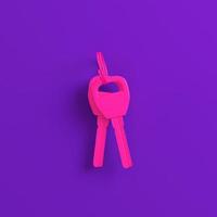 Pink home or car keys on purple background. Minimalism concept photo