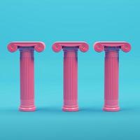 Pink three ancient columns on bright blue background in pastel colors photo