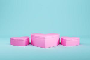 Pink heart shape pedestal with on light blue background for product display. photo