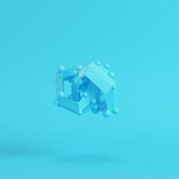 Abstract low poly shape on bright blue background in pastel colors photo