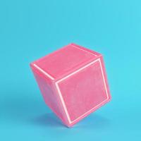 Abstract pink cube with scratches on bright blue background in pastel colors photo